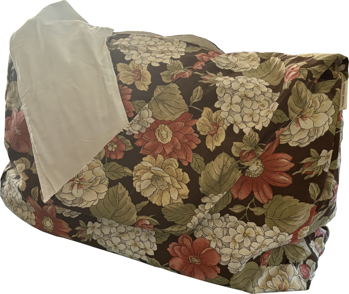 Front view of Cinnamon Flora Twill Sling Bag with large floral print in browns, creams, and cinnamon on twill fabric.