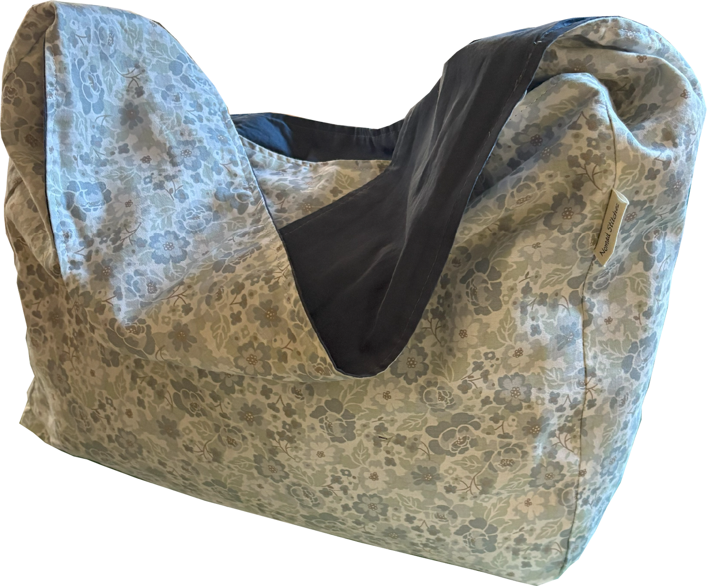 Front view of the 1/2 Pint ~ Stitch Shoulder Bag in soft blue ditsy floral, a compact crossbody made from repurposed natural fiber textiles.