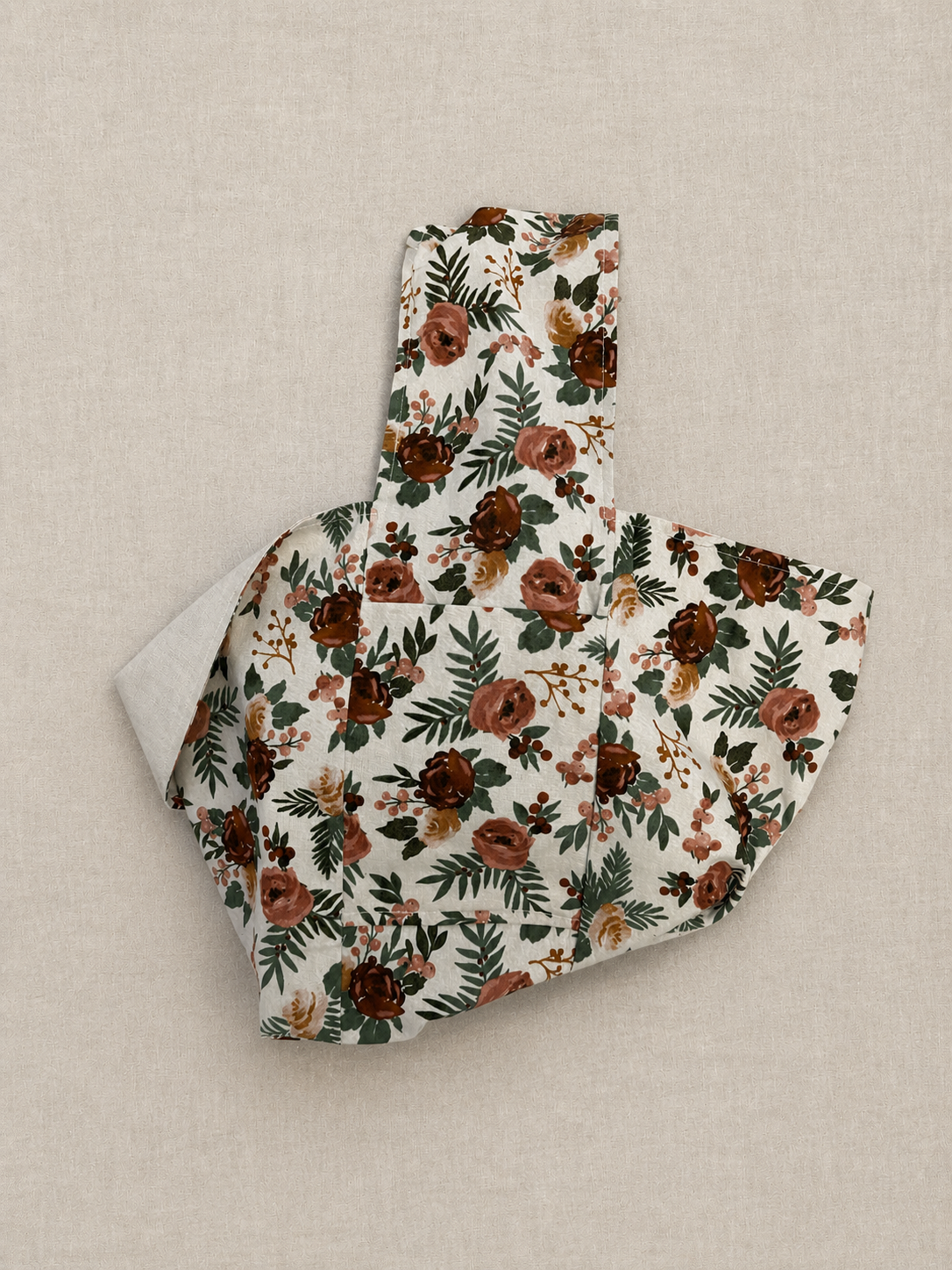 Pocket view of the Evergreen Rose 1/2-Pint Stitch Bag featuring the spacious interior pocket design, natural linen-look fabric, and soft botanical floral print in earthy rust, blush, and evergreen tones.
