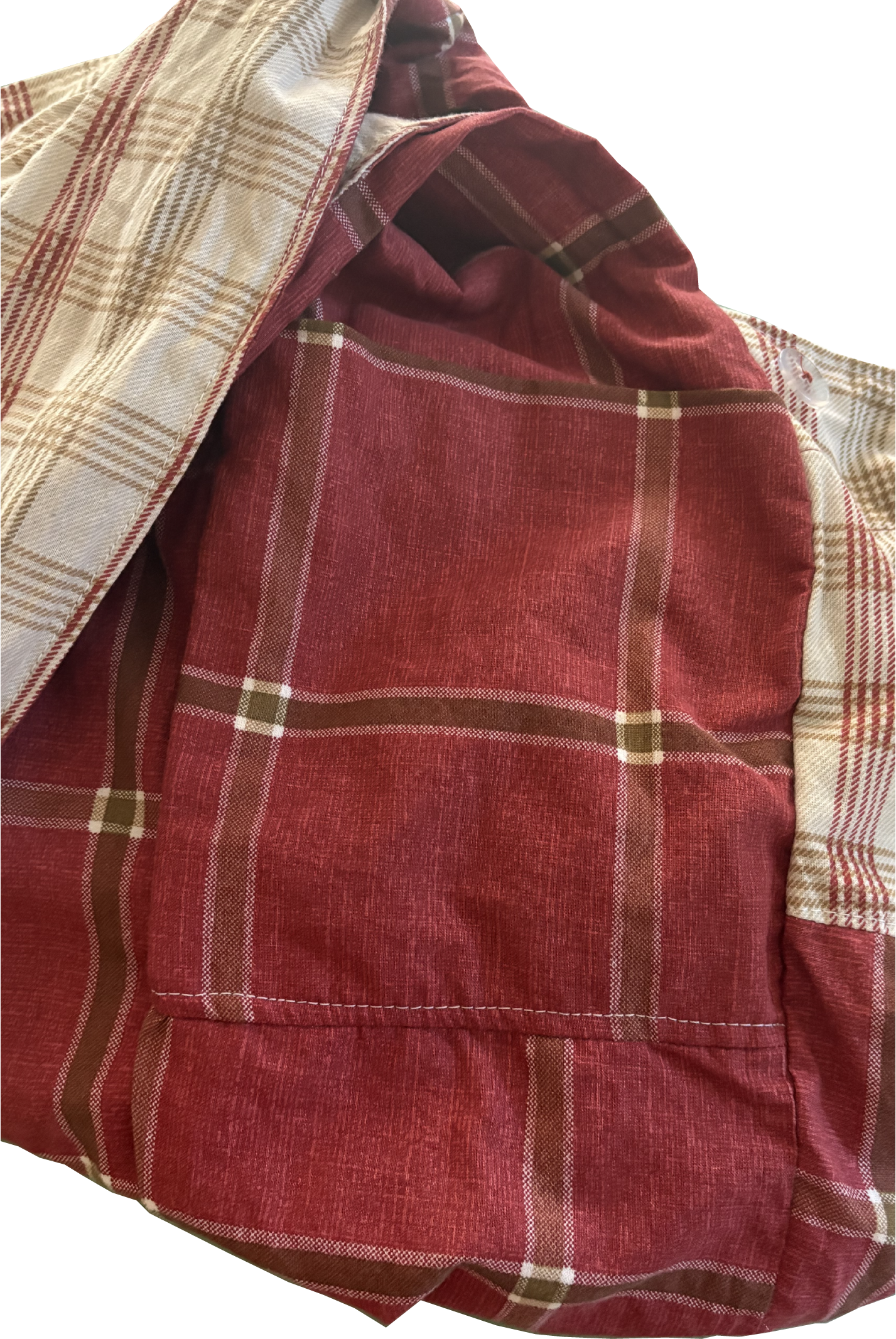 Interior view of Rust & Natural Windowpane Sling Bag with internal pockets for organized storage.