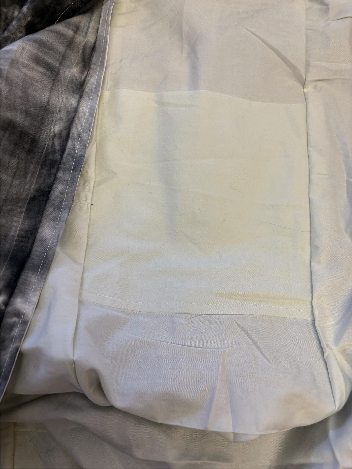 Interior of the tie-dye sling bag featuring a solid-color lining.