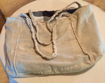 Close-up of the Leigh Bag’s braided handle showing detailed texture and artisan craftsmanship.