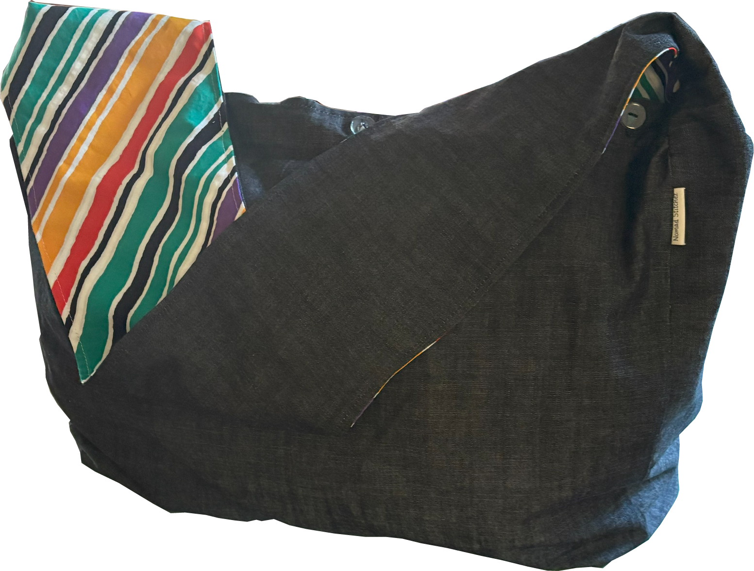 Front view of Nomad Stitchez Black Denim Sling Bag with bold bias-cut stripe in primary colors.