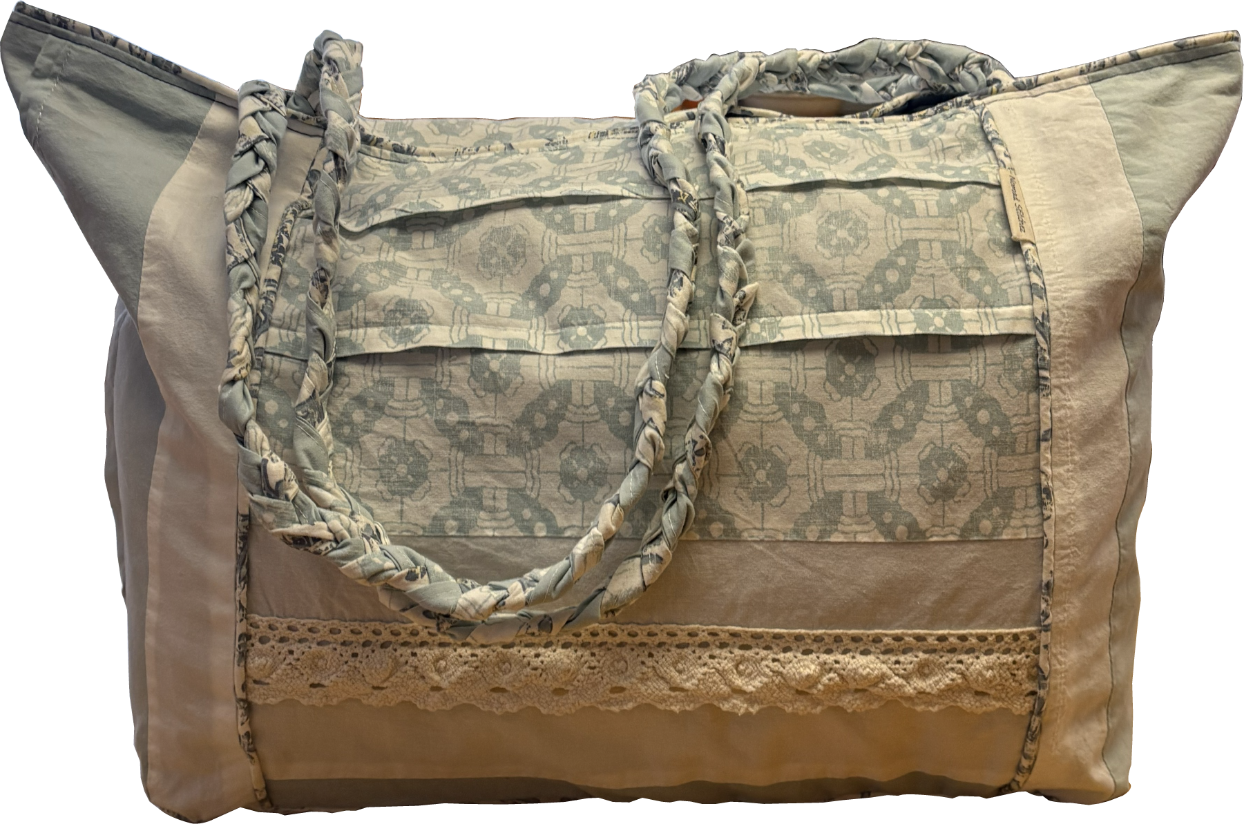 Boho Chic Leigh Bag made from repurposed cotton fabrics, featuring blue and white prints with coordinating solid panels, cotton lace trim. and braided handle.