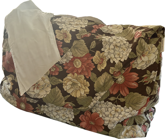 Front view of Cinnamon Flora Twill Sling Bag with large floral print in browns, creams, and cinnamon on twill fabric.