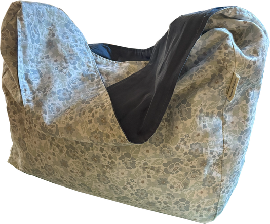 Front view of the 1/2 Pint ~ Stitch Shoulder Bag in soft blue ditsy floral, a compact crossbody made from repurposed natural fiber textiles.