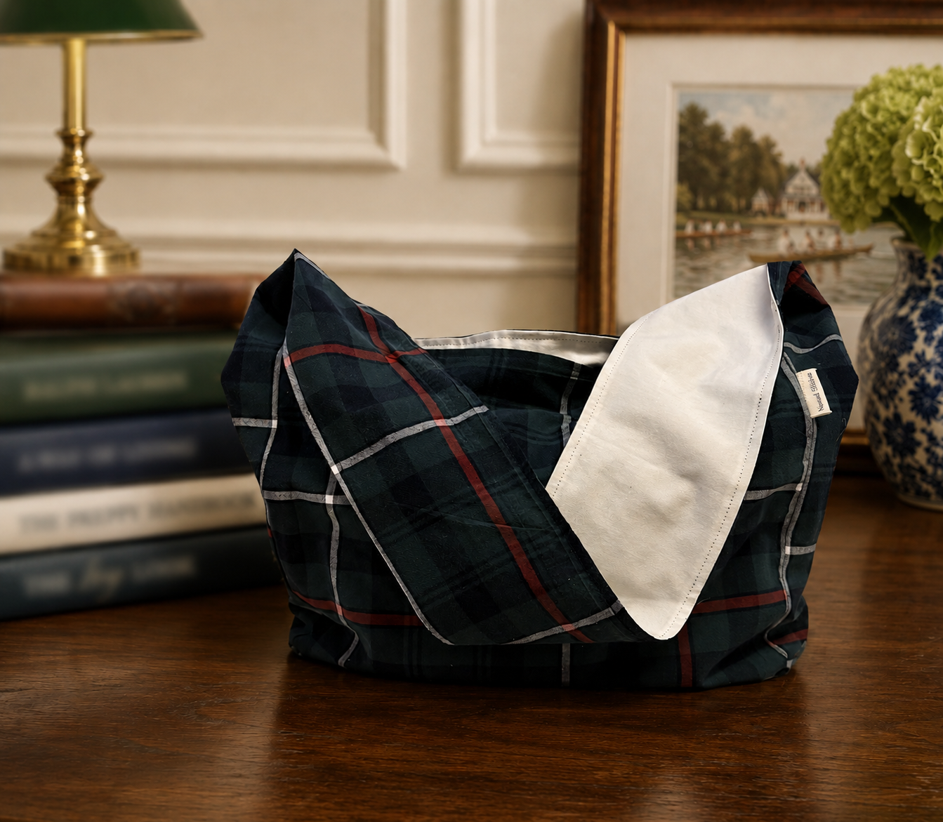 Front view of the Half-Pint Stitch Bag featuring a navy plaid cotton shell, soft structure, and handcrafted stitching details with a relaxed everyday silhouette.
