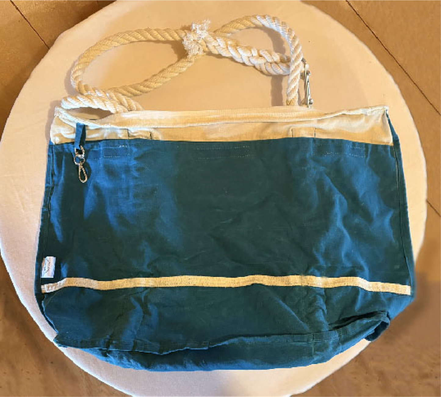 Interior pockets and waxed canvas wet bag compartment with removable key fob.