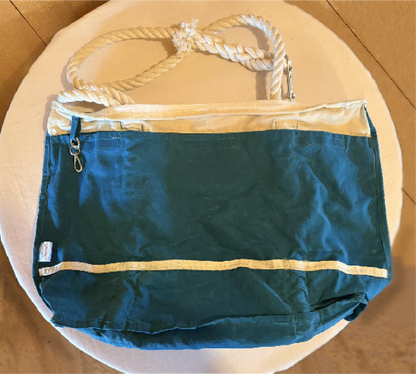 Interior pockets and waxed canvas wet bag compartment with removable key fob.