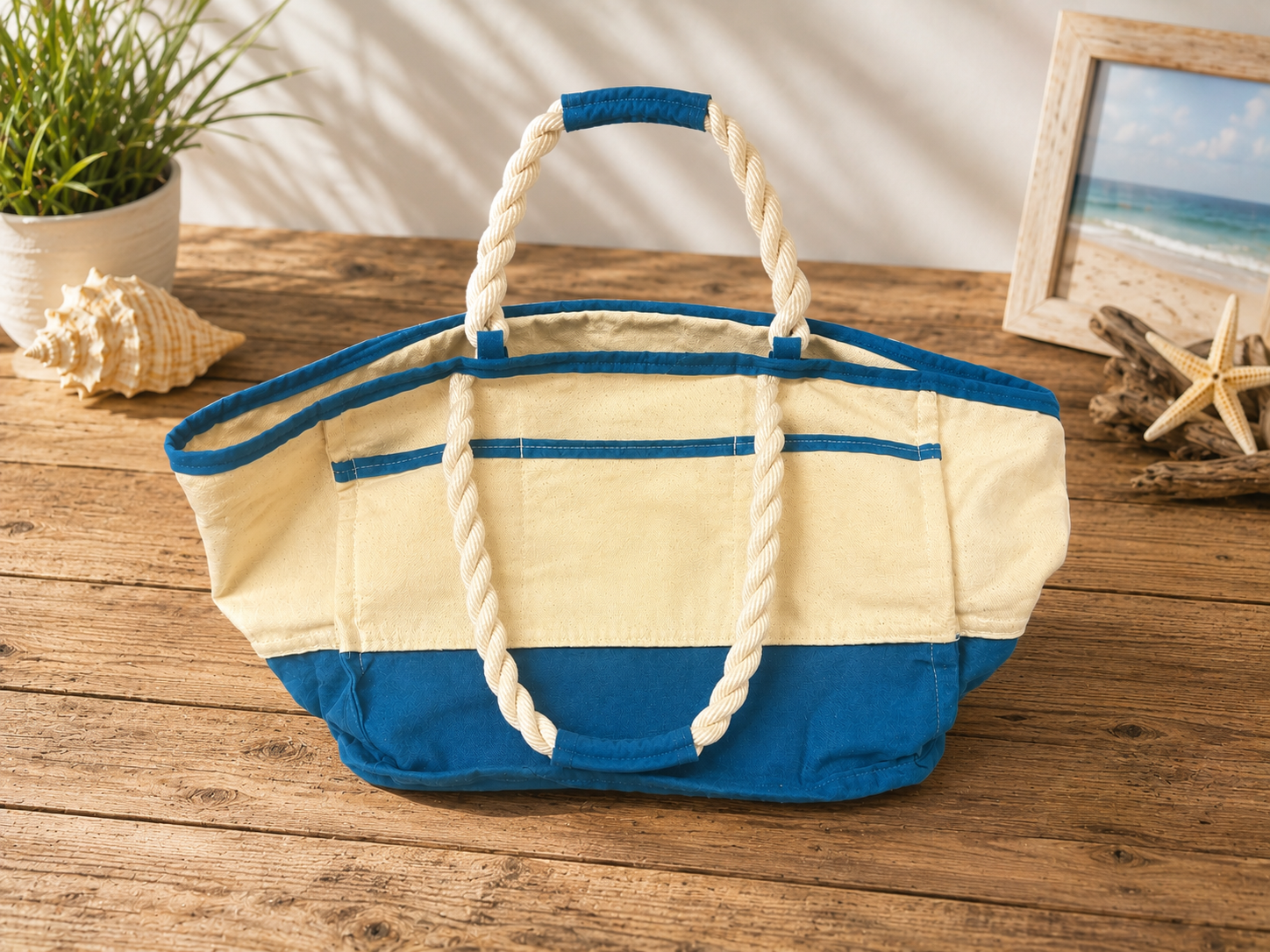 Close-up interior view of the Dockside Tote side pockets featuring organized cotton canvas compartments with teal waxed canvas trim designed to hold sunglasses, keys, sunscreen, and everyday essentials.