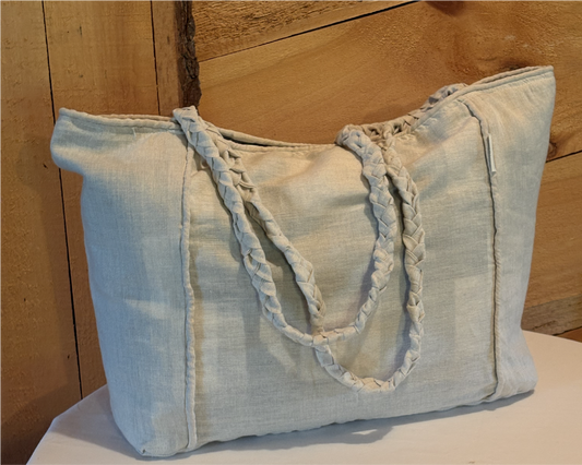 Front view of the Leigh Bag made from a linen-cotton blend with piped edges and a relaxed, structured shape.