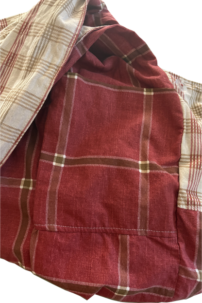 Interior view of Rust & Natural Windowpane Sling Bag with internal pockets for organized storage.