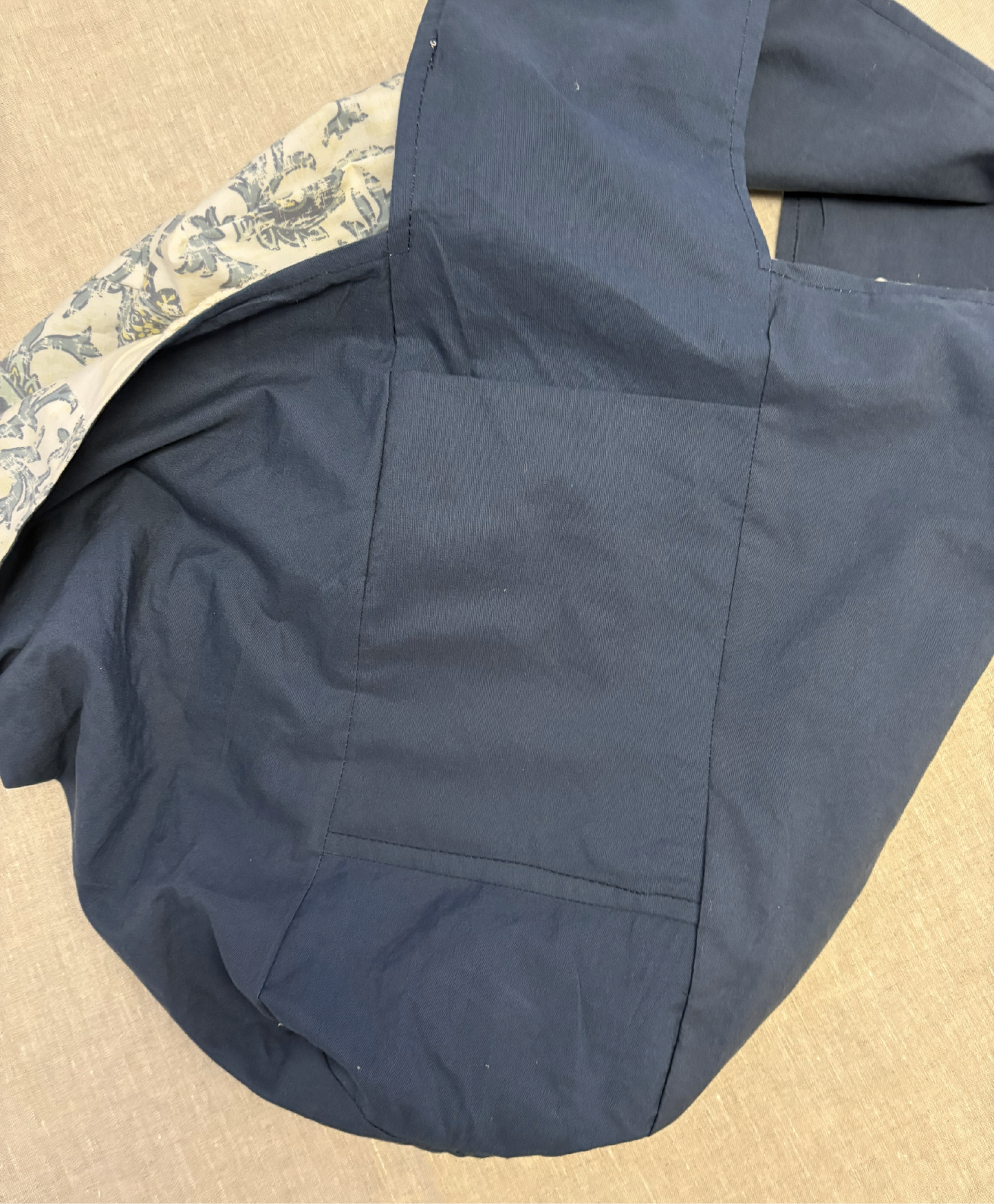 Close-up pocket view of the blue  ½ pint stitch bag highlighting the solid lining and neatly stitched pocket design.