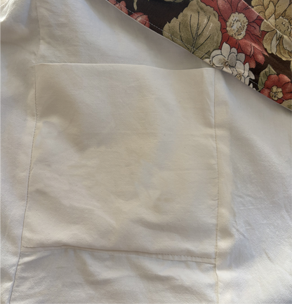 Interior view of Cinnamon Flora Twill Sling Bag with internal pockets for organized storage.