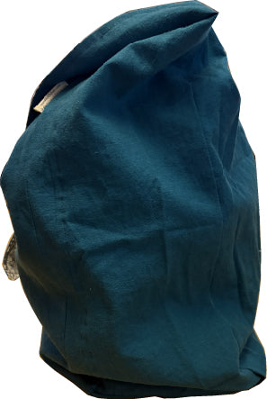 Side view of a linen sling bag showing its slim profile and strap.