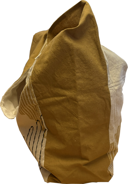 Side view of the mustard and black sling bag showing its slim profile and mustard yellow strap.