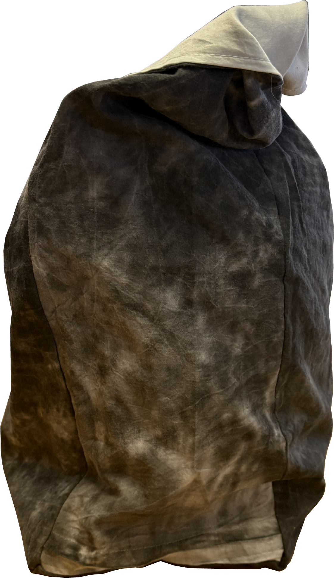 Side view of a black and white tie-dye sling bag showing its slim profile and fixed strap.