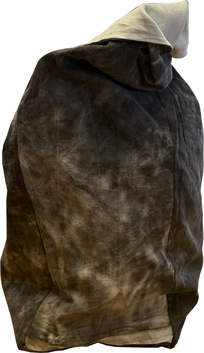 Side view of a black and white tie-dye sling bag showing its slim profile and fixed strap.