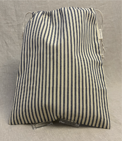 Vertical blue stripe cotton utility bag with a cotton drawstring closure, 12in x 15in size, part of the Essentials Collection.