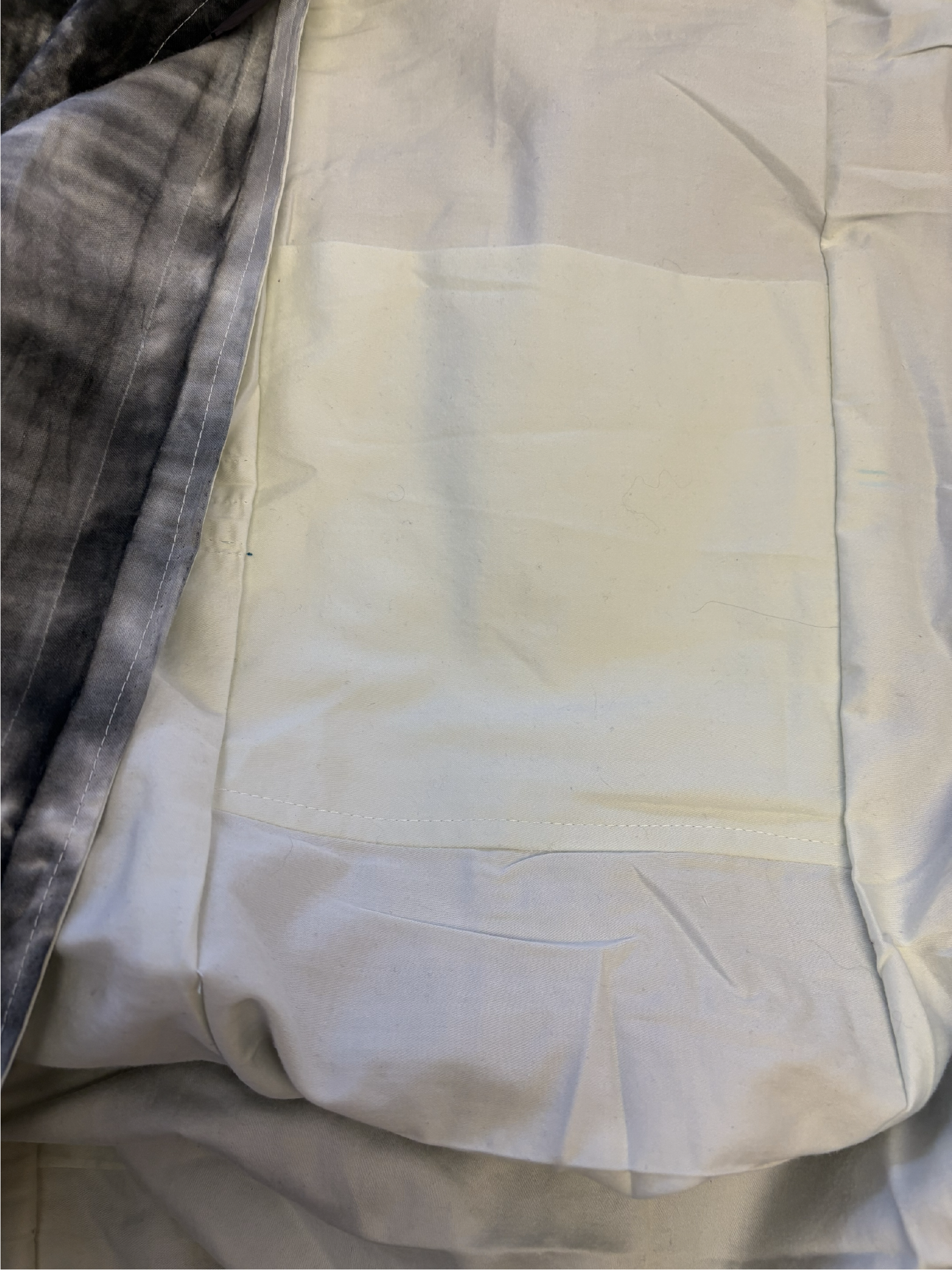 Interior of the tie-dye sling bag featuring a solid-color lining.